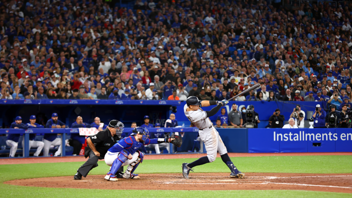 Aaron Judge of the New York Yankees hits his 61st home run of the season in the seventh inning against the Toronto Blue Jays