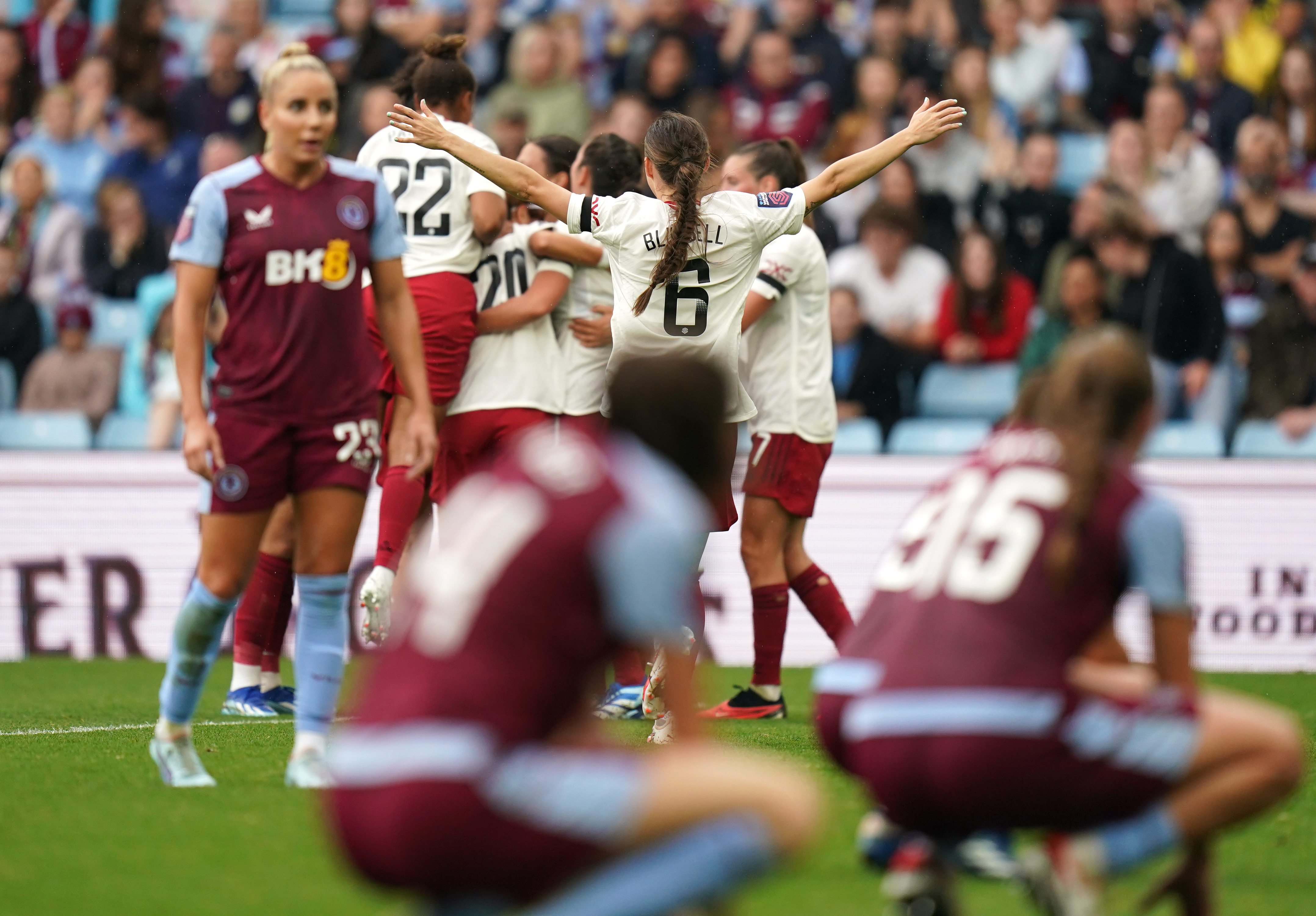 Manchester United celebrate scoring in the WSL game at Aston Villa.