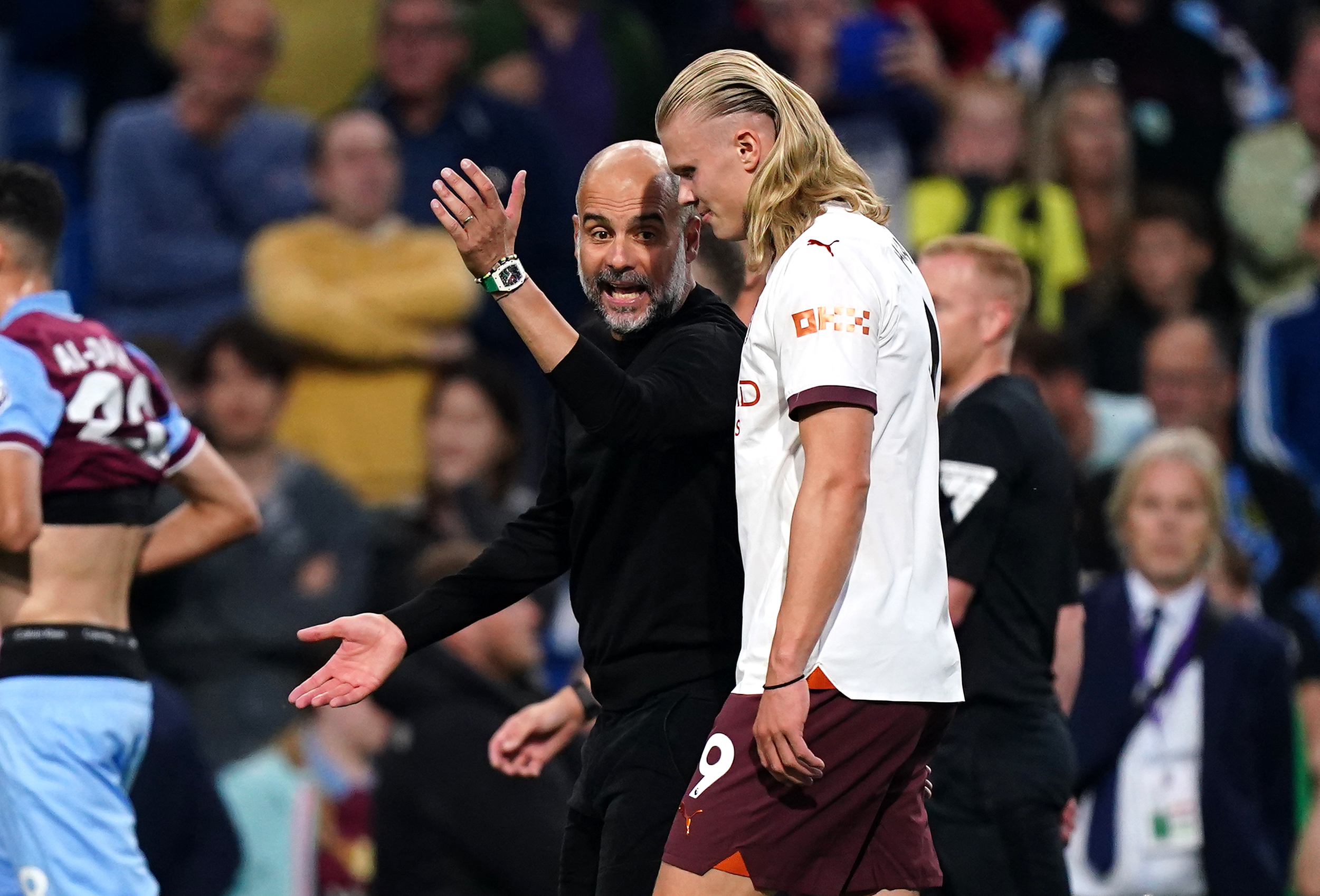 Pep Guardiola has words with Erling Haaland at half-time