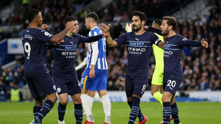 Manchester City's players celebrate their opening goal against Brighton