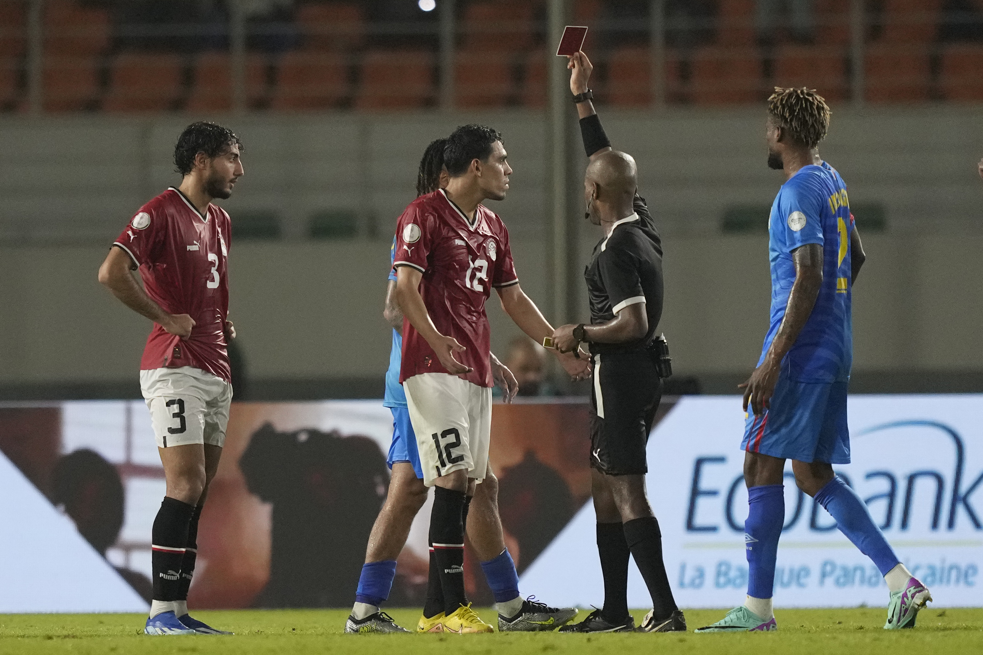 Mohamed Hamdy, centre, is sent off