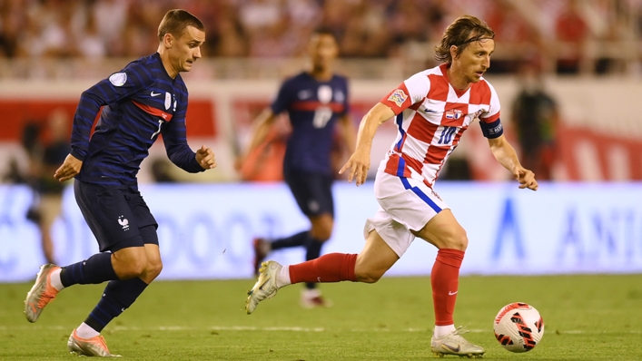 France's Antoine Griezmann (L) chases Croatia's Luka Modric (R)