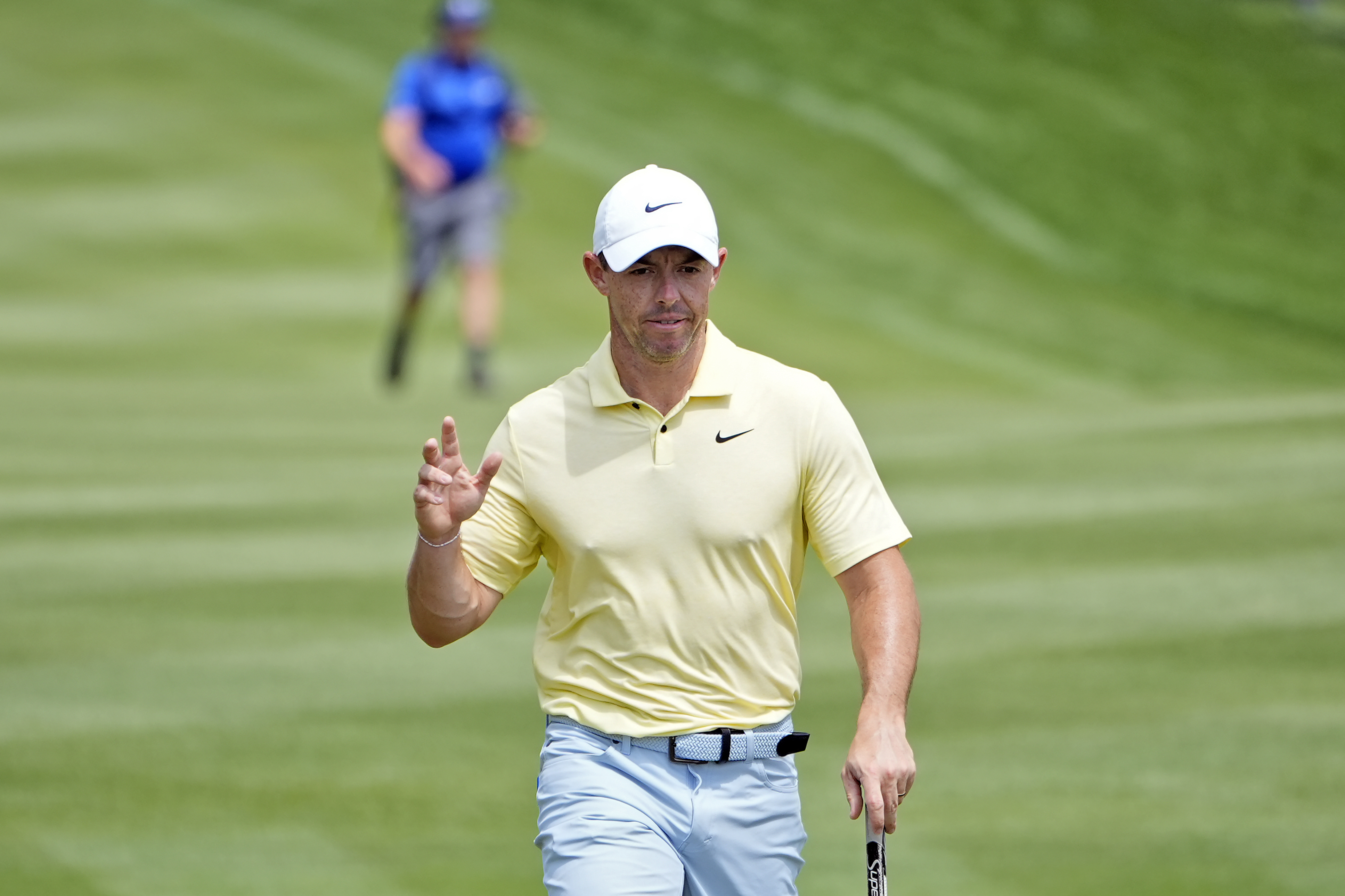 Rory McIlroy waves to the gallery