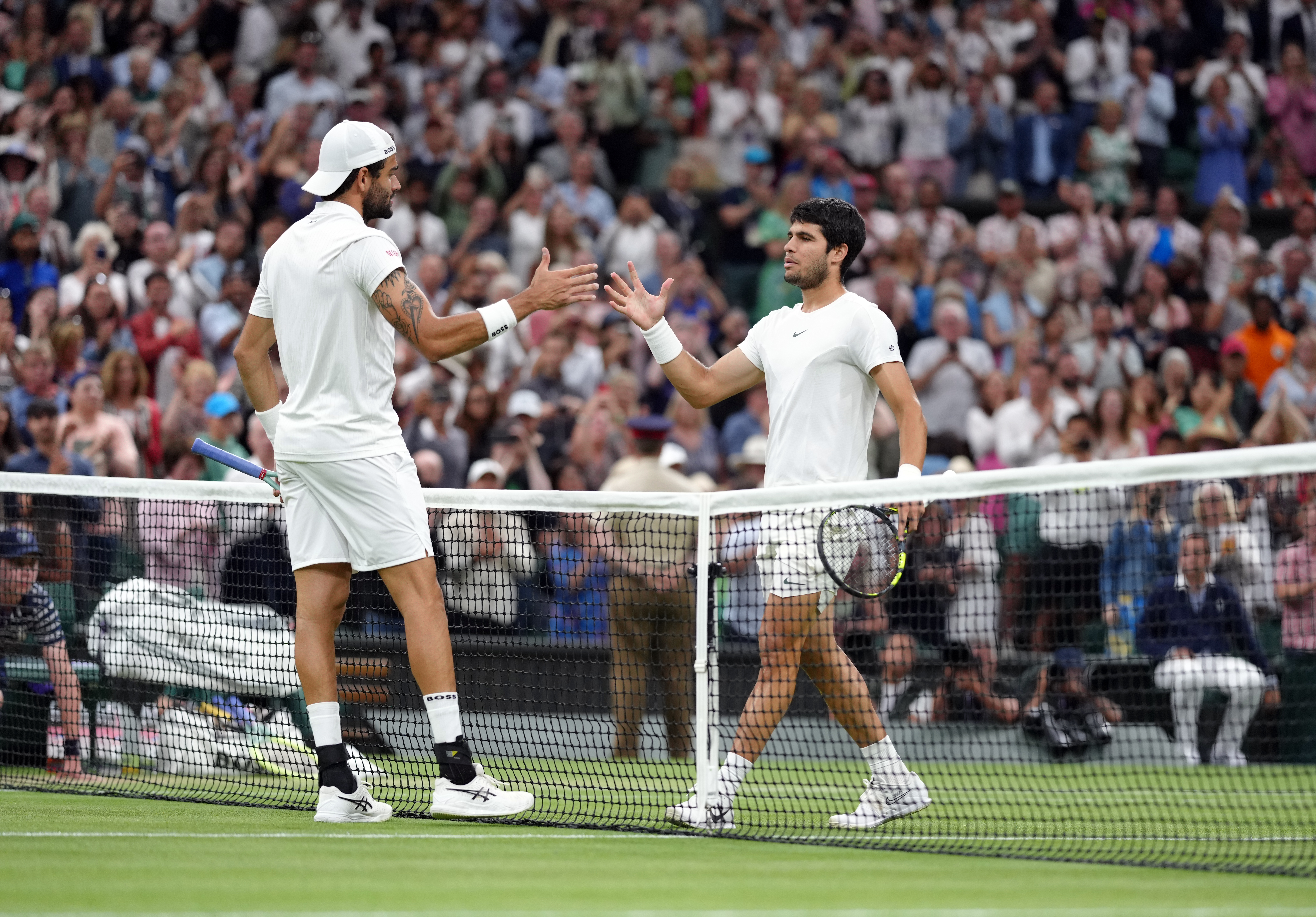 Carlos Alcaraz, right, overcame Matteo Berrettini to reach the last eight