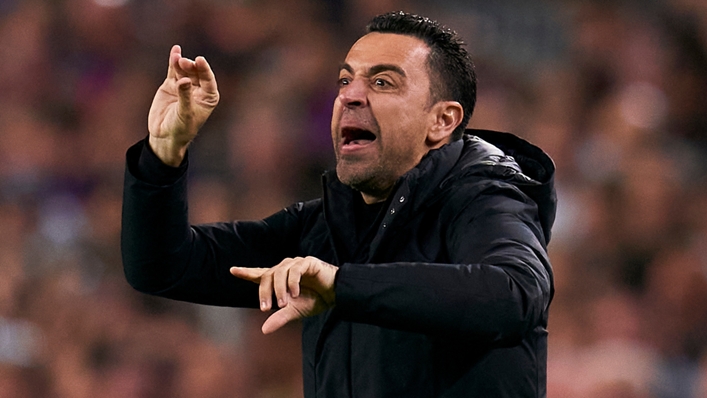 Xavi reacts on the touchline during Barcelona's win against Real Madrid