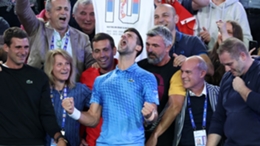 Novak Djokovic celebrates winning a 10th Australian Open title
