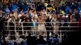 Ukraine’s Oleksandr Usyk celebrates after beating Britain’s Daniel Dubois (Czarek Sokolowski/AP)