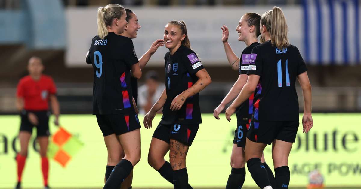 England players in action during their Women's World Cup play-off semi-final first leg against Greece