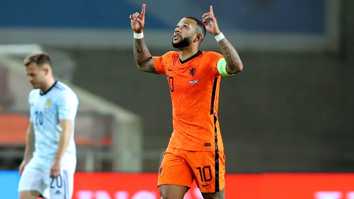 Memphis Depay celebrates after scoring against Scotland.