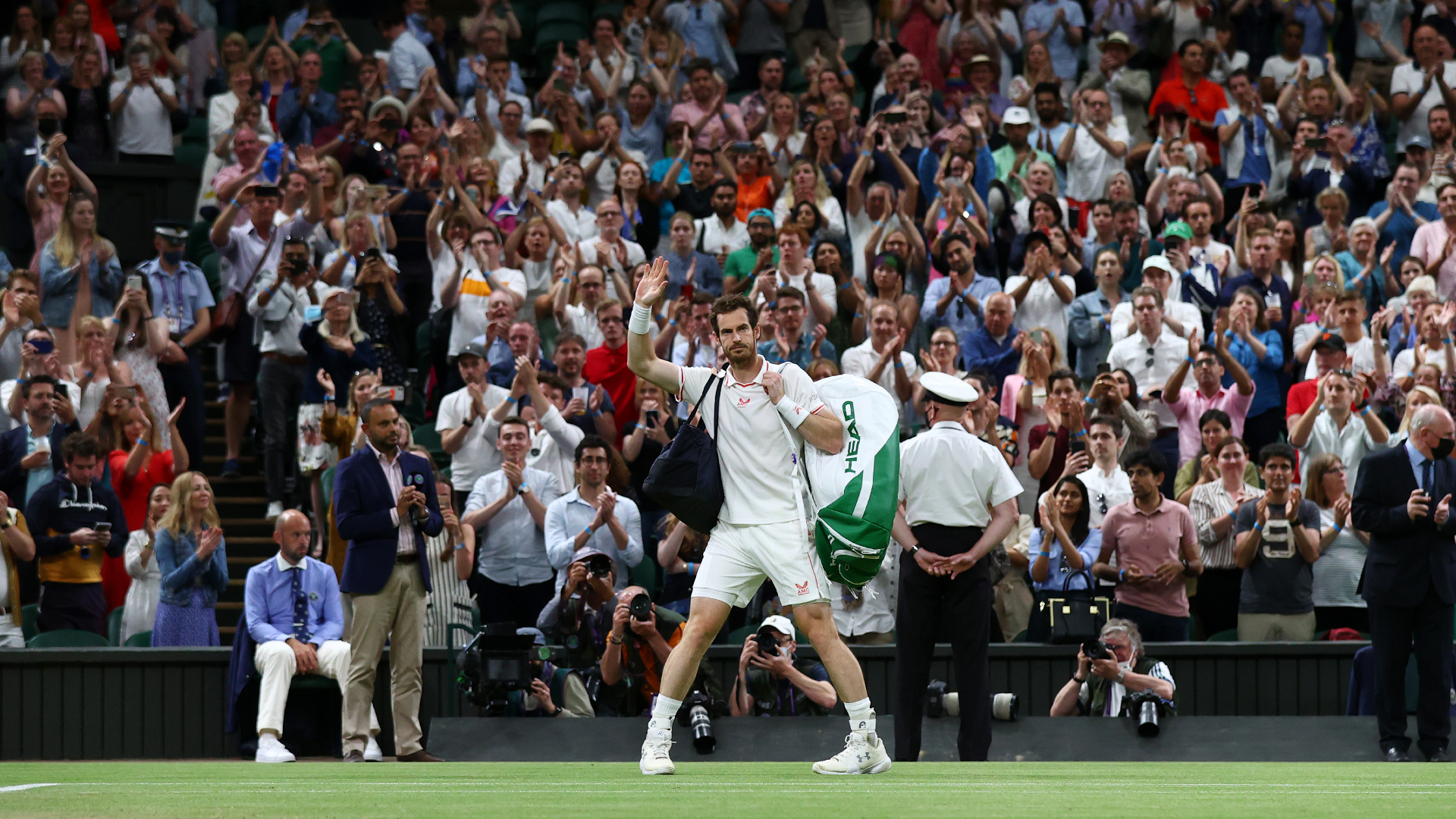 Andy Murray waves to the Wimbledon crowd