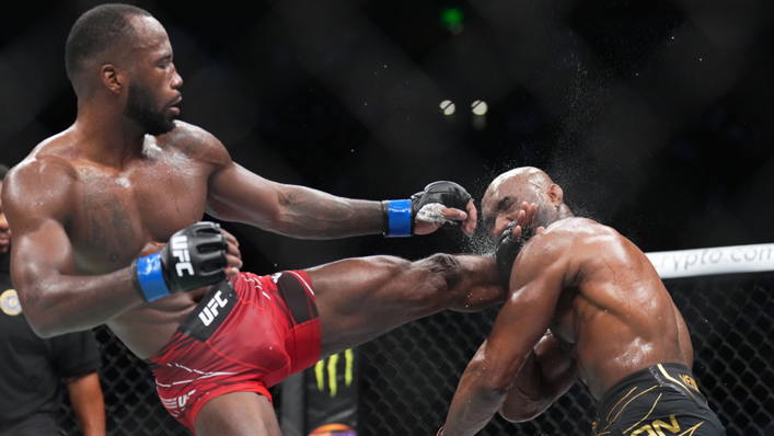 Leon Edwards lands a head kick to Kamaru Usman in the UFC welterweight championship fight during the UFC 278