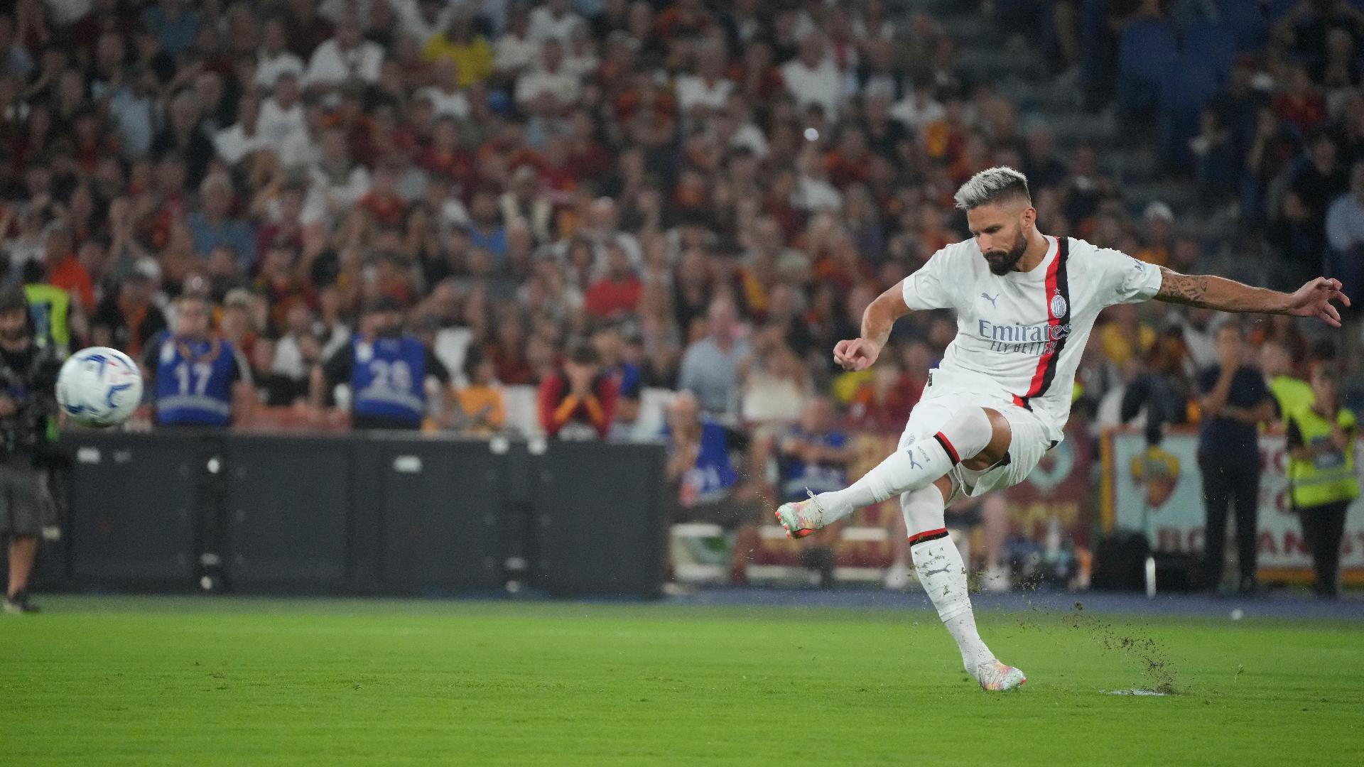 Olivier Giroud scored from the spot to help Milan to a 2-0 win over Roma (Gregorio Borgia/AP)