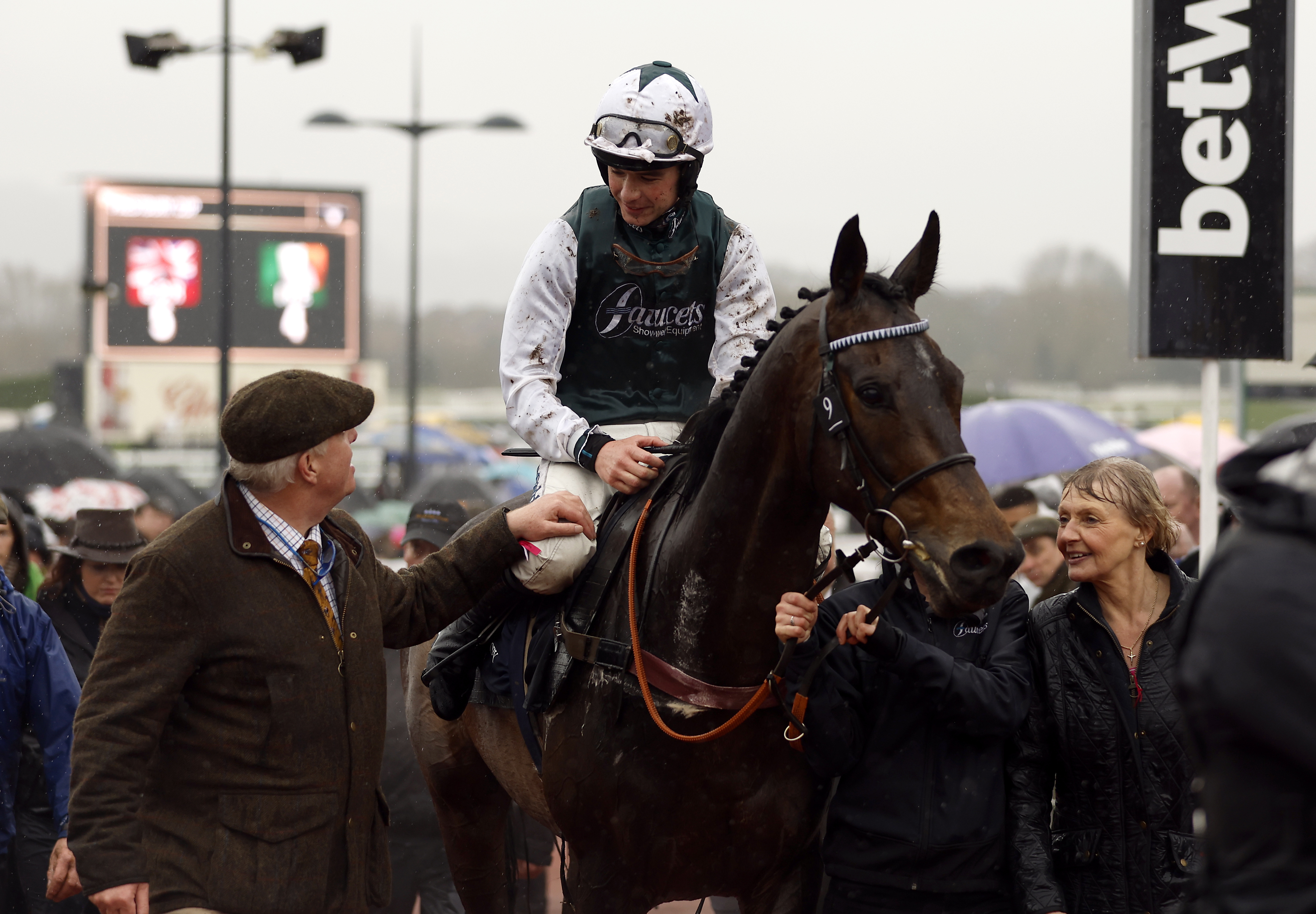 Andy Edwards (left) leading in L'Homme Presse after his win in the Brown Advisory Novices' Chase