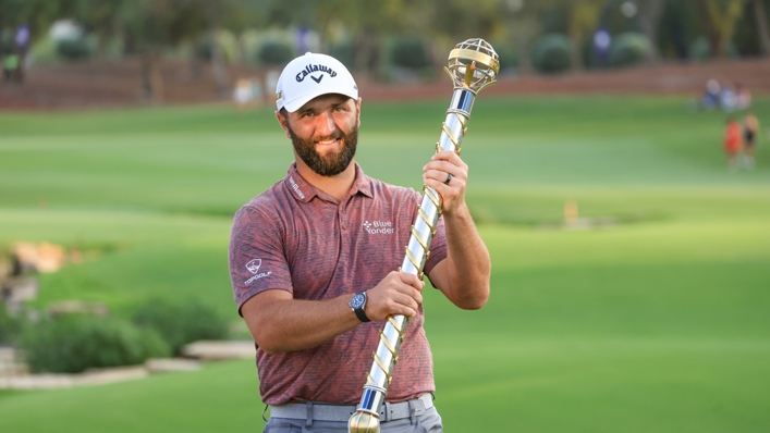 Jon Rahm holds his third DP World Tour Championship trophy