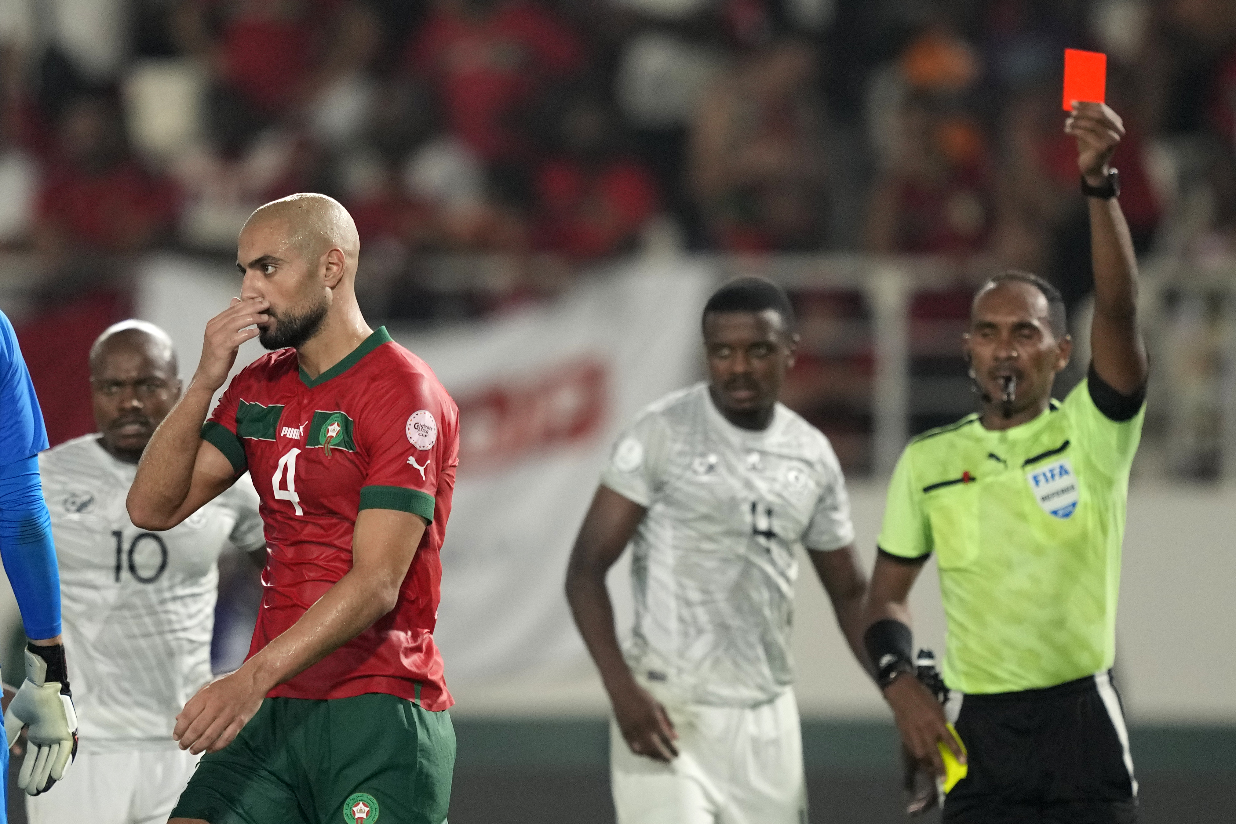 Morocco’s Sofyan Amrabat walks off the pitch after receiving a red card