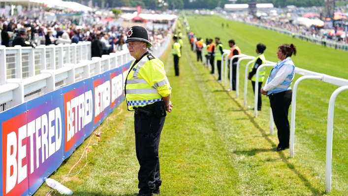 A police officer stands by the track during the Derby