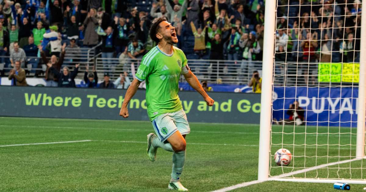 Seattle Sounders celebrate their late winner against Sporting Kansas City at Lumen Field