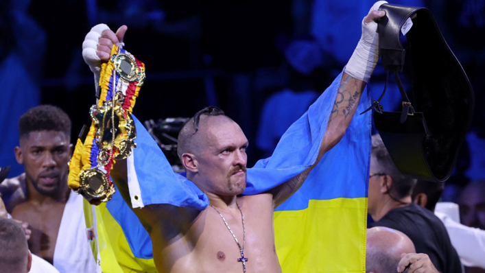 Oleksandr Usyk celebrates after winning the heavyweight boxing rematch for the WBA, WBO, IBO and IBF titles against Anthony Joshua