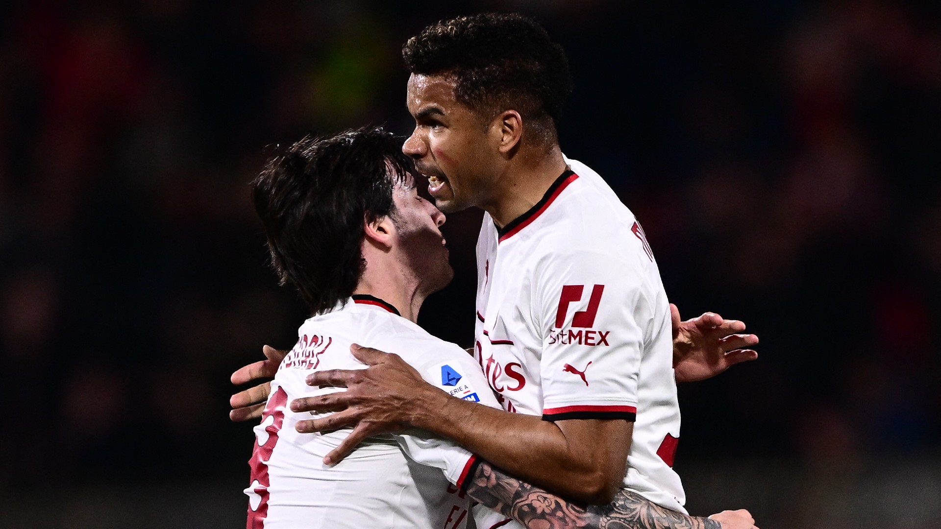 Junior Messias celebrates with Sandro Tonali after scoring against Monza