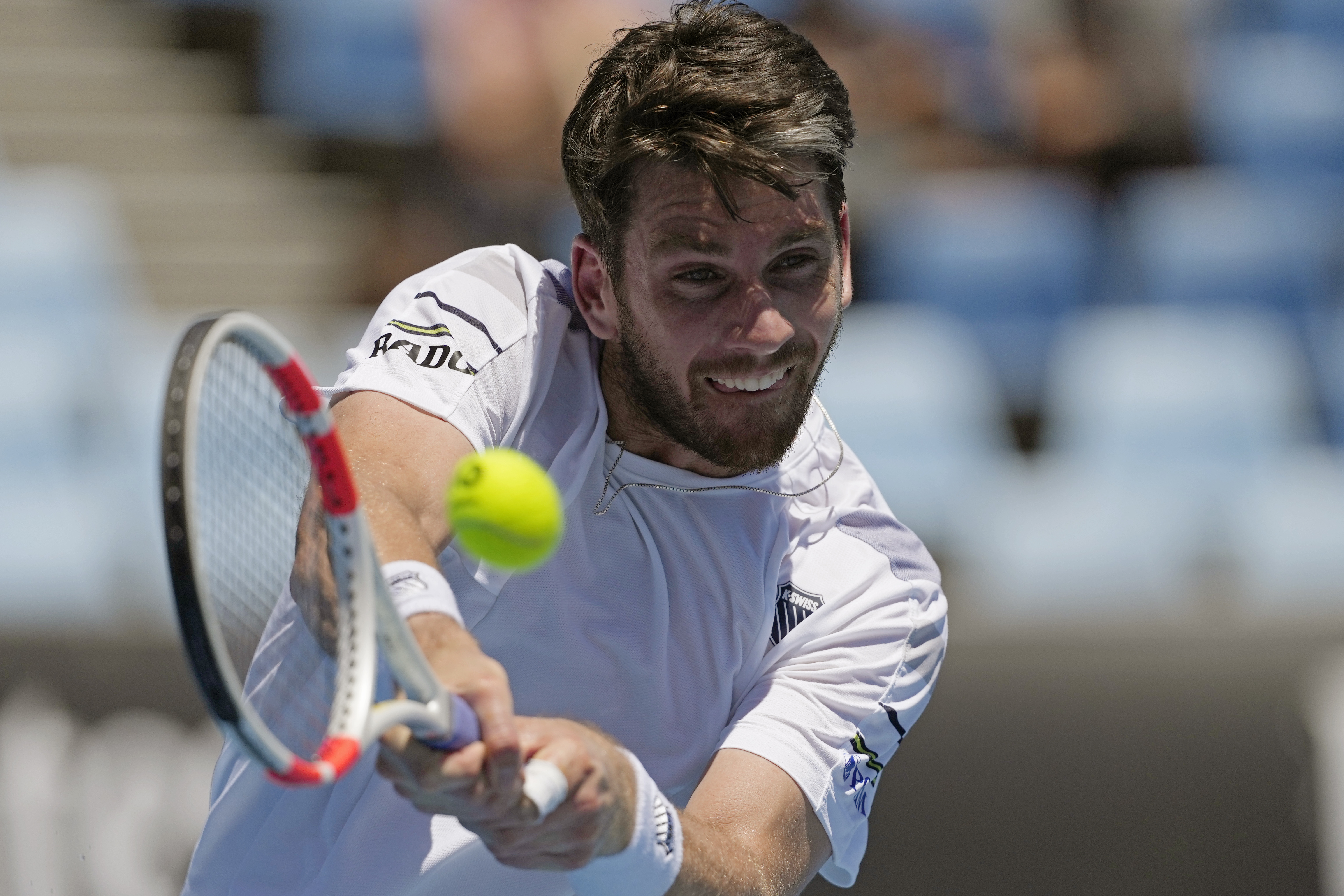 Cameron Norrie hits a backhand