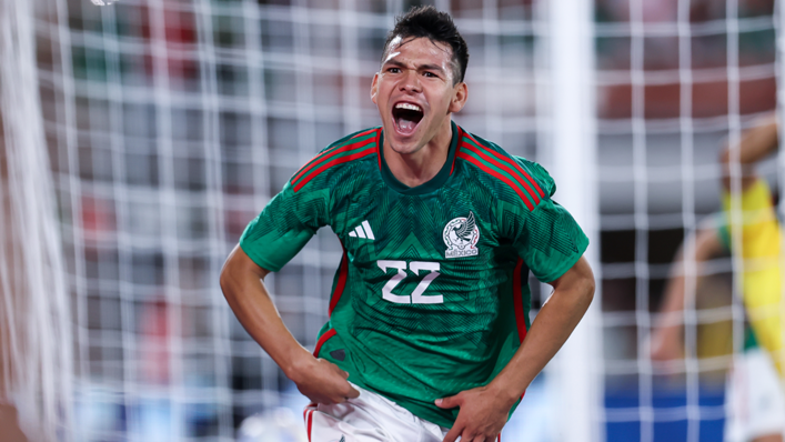 Hirving Lozano celebrates after scoring his team's first goal during the friendly match between Mexico and Peru at the Rose Bowl
