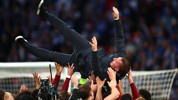Leicester's players celebrate with Brendan Rodgers