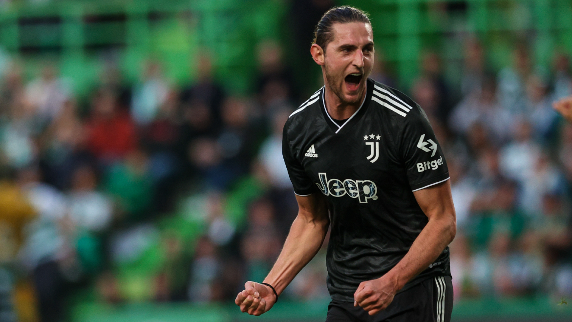 Adrien Rabiot celebrates opening the scoring at Estadio Jose Alvalade