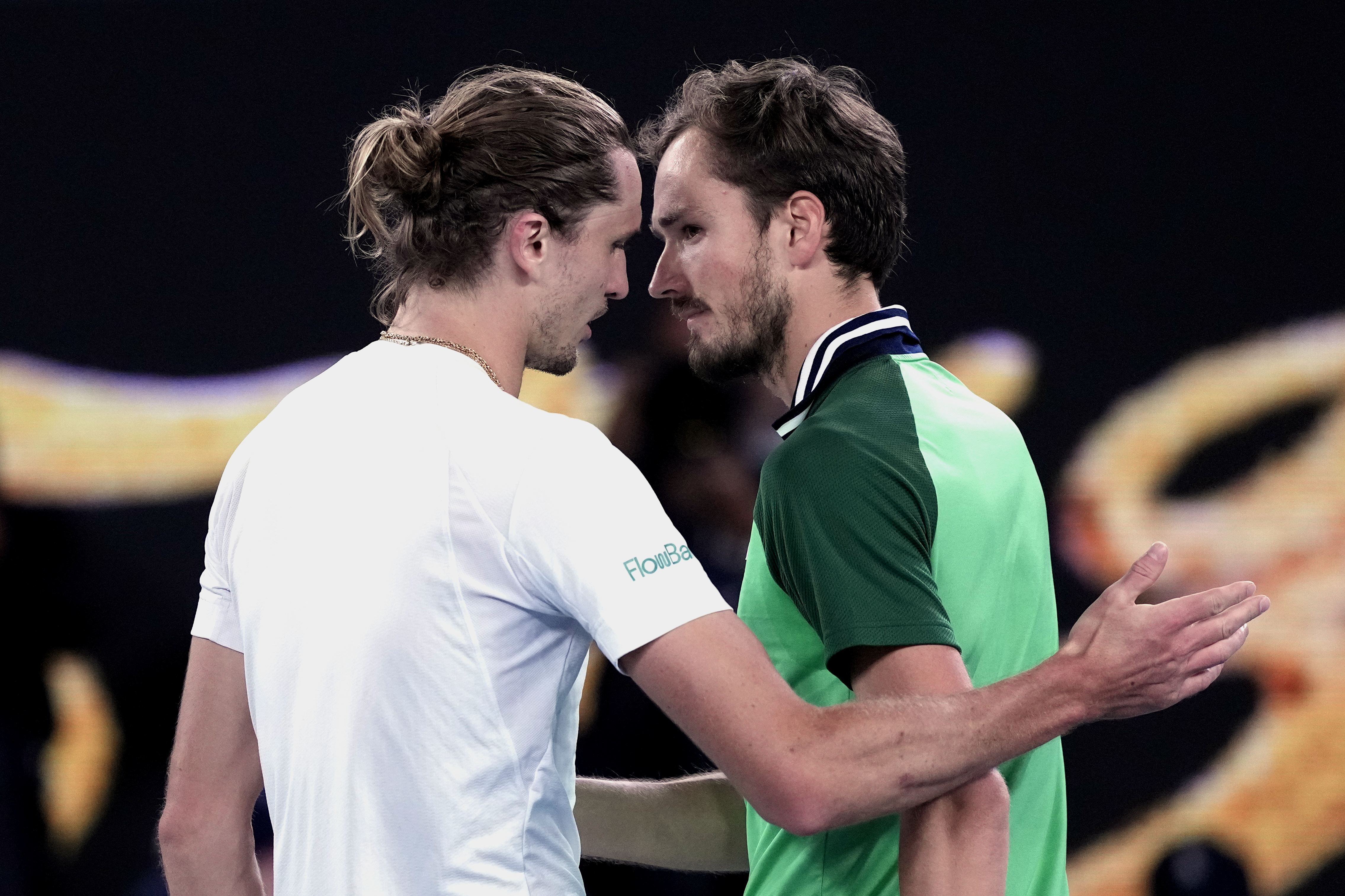 Daniil Medvedev, right, is congratulated by Alexander Zverev