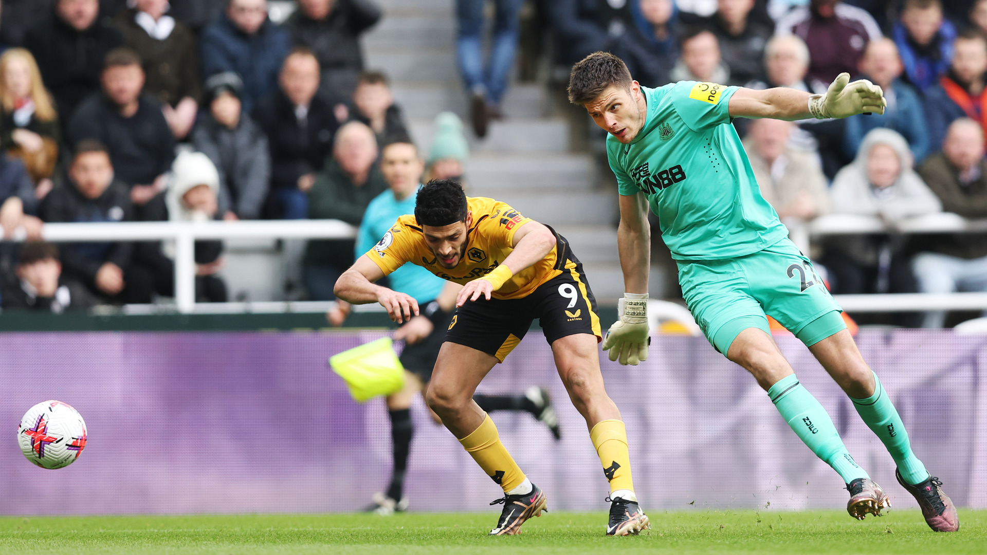 Wolves wanted a penalty after this collision between Raul Jimenez (L) and Nick Pope (R)