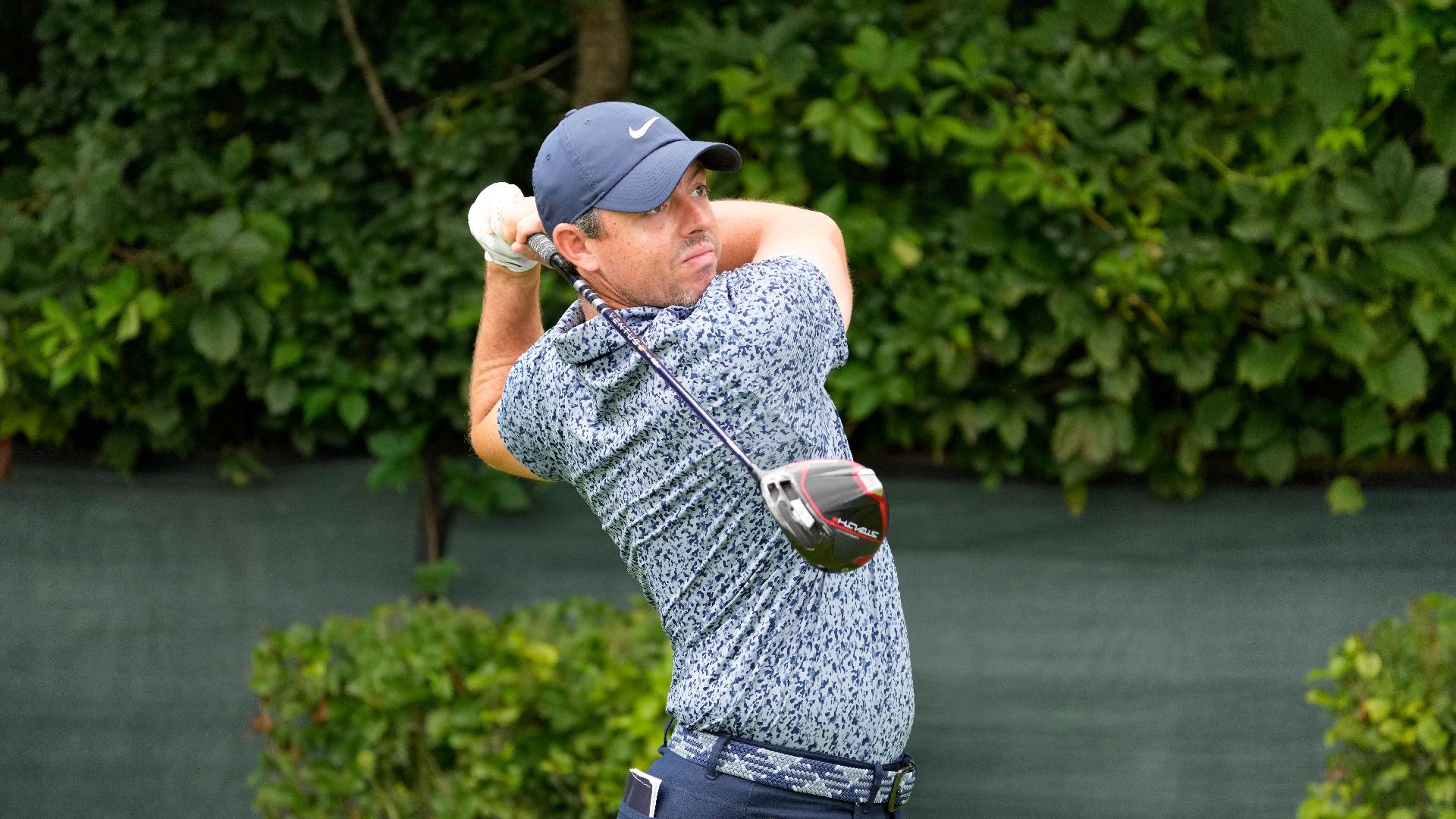 Rory McIlroy watches his tee shot on the second hole during the first round of the BMW Championship (Charles Rex Arbogast/AP)