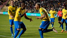 Dani Alves (l) and Richarlison celebrate the latter's goal in the 4-0 win for Brazil in Bolivia in World Cup qualifying
