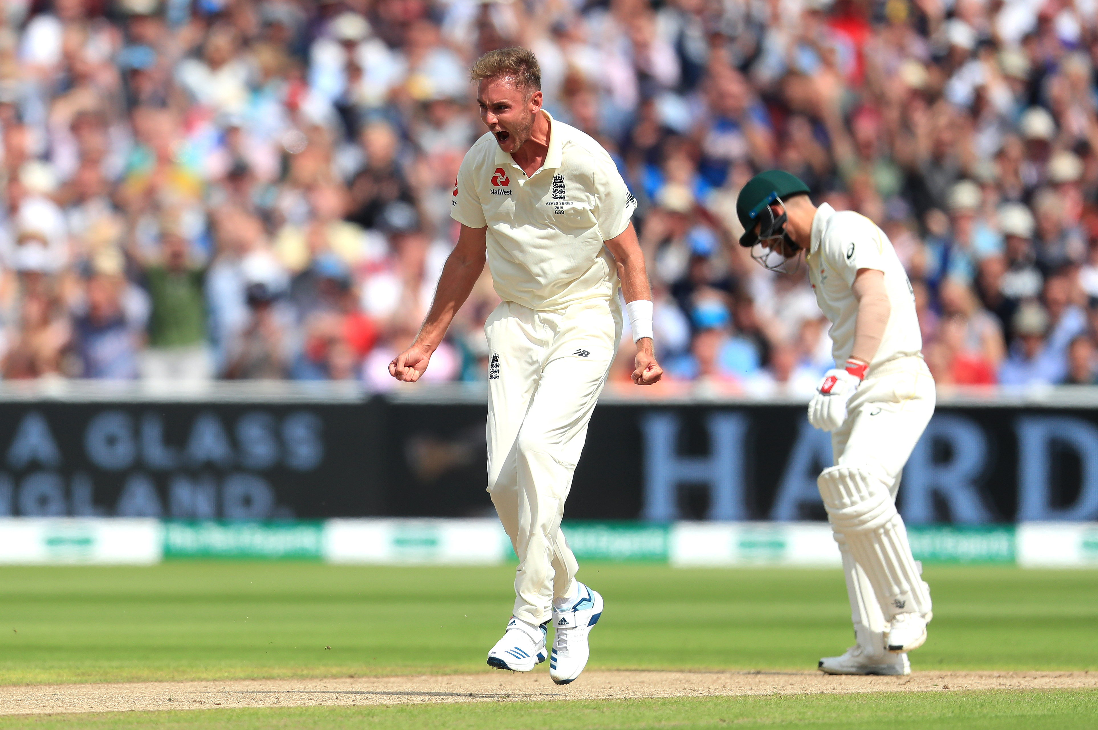 Stuart Broad celebrates taking the wicket of Australia’s David Warner, right, at Edgbaston in 2019
