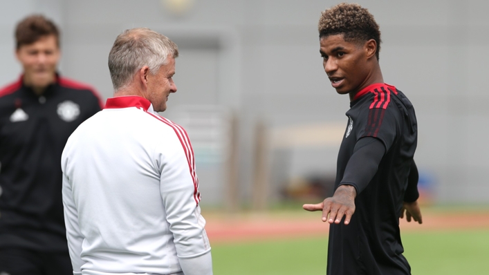 Ole Gunnar Solskjaer (L) and Manchester United's Marcus Rashford (R)