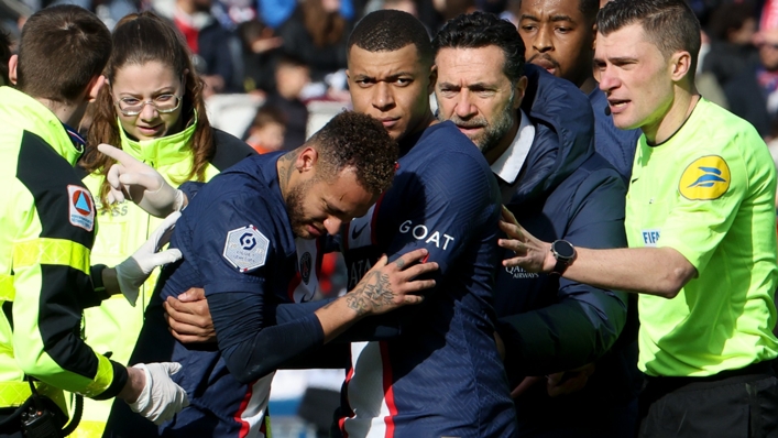 Neymar attempts to walk from the field against Lille before having to be carried off