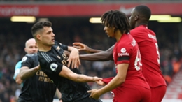Granit Xhaka (L) and Trent Alexander-Arnold (R) confront each other