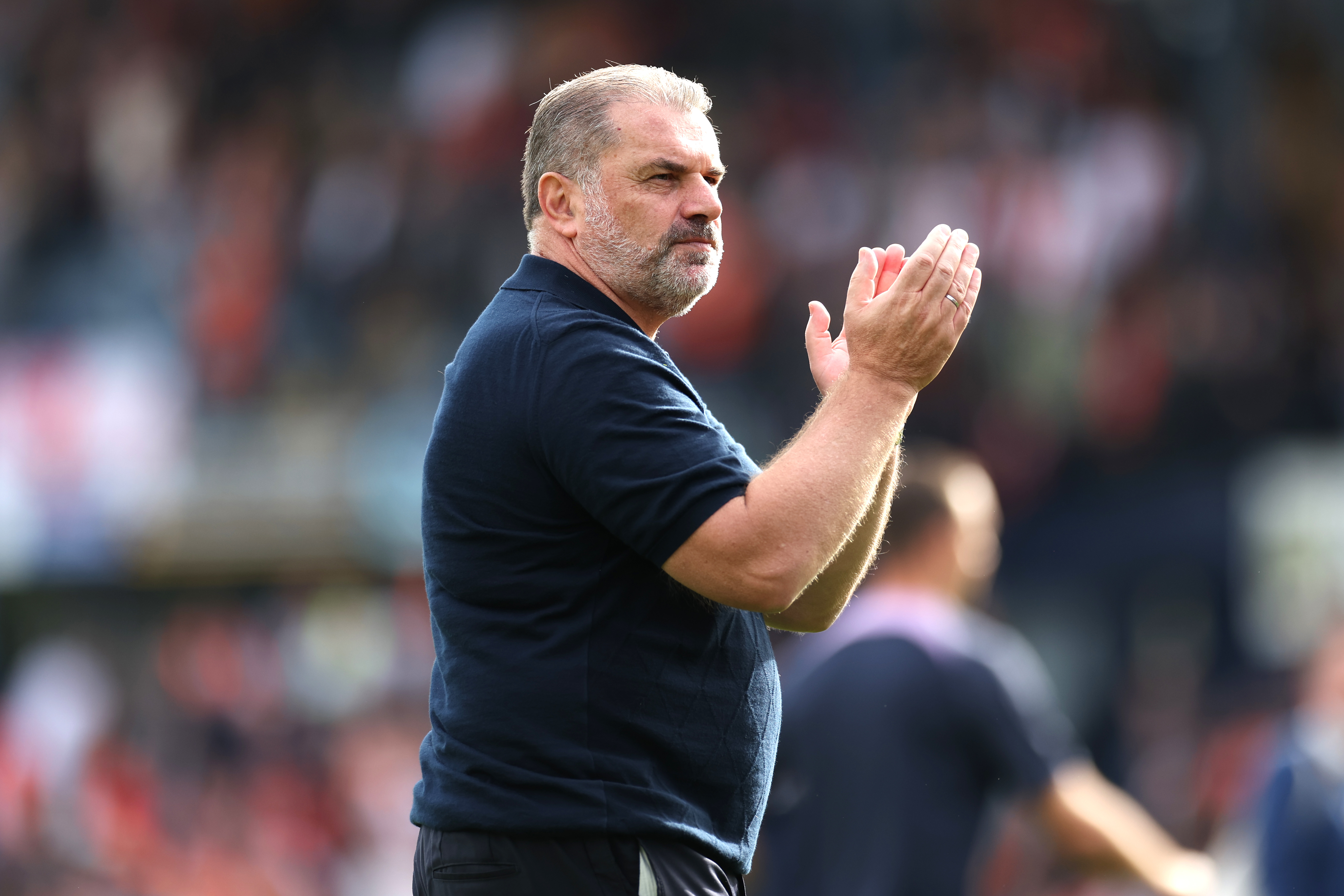 Tottenham manager Ange Postecoglou applauds the fans after the final whistle