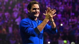 Roger Federer applauds fans at the O2 Arena after playing his final match as a professional