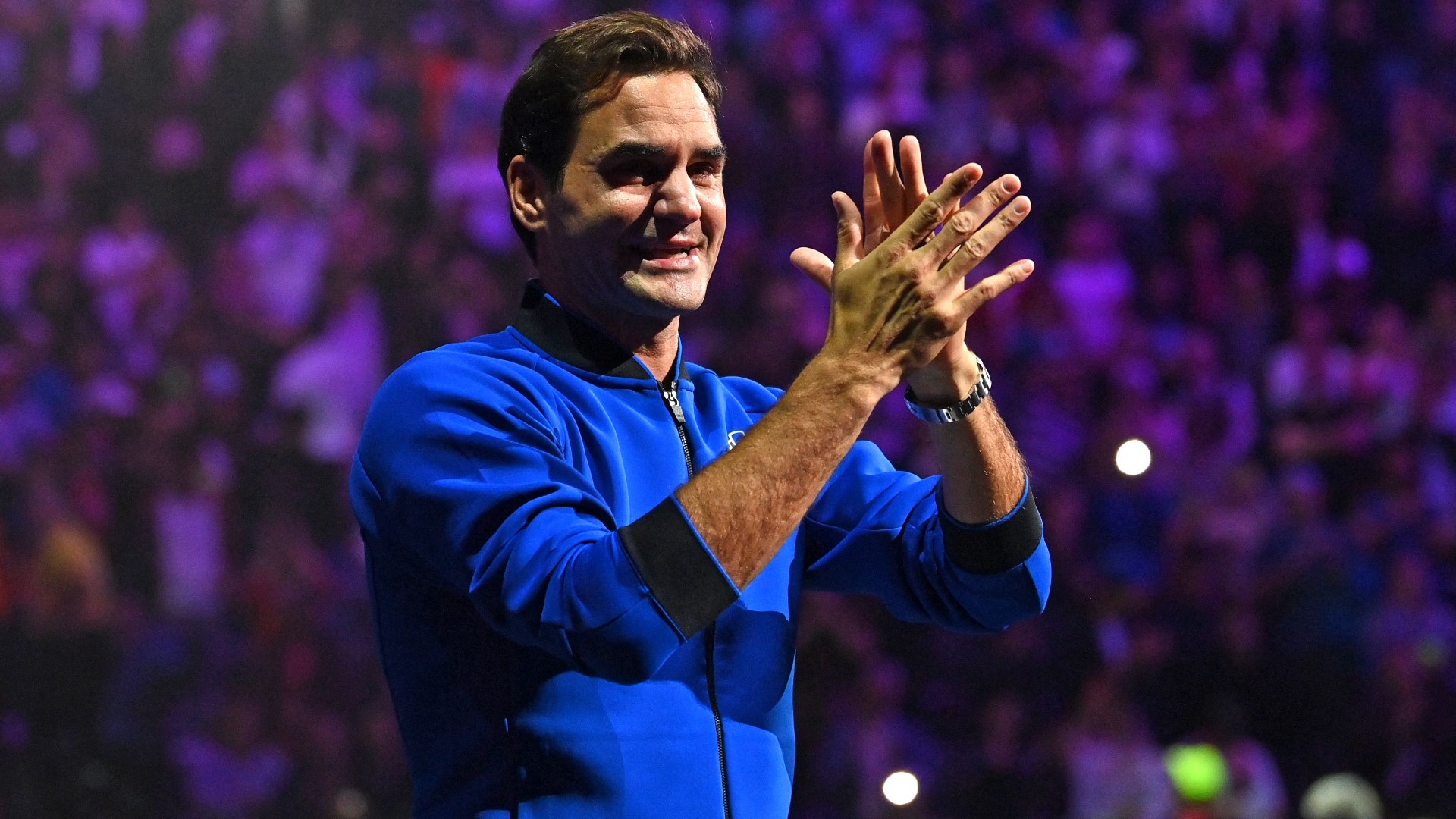 Roger Federer applauds fans at the O2 Arena after playing his final match as a professional