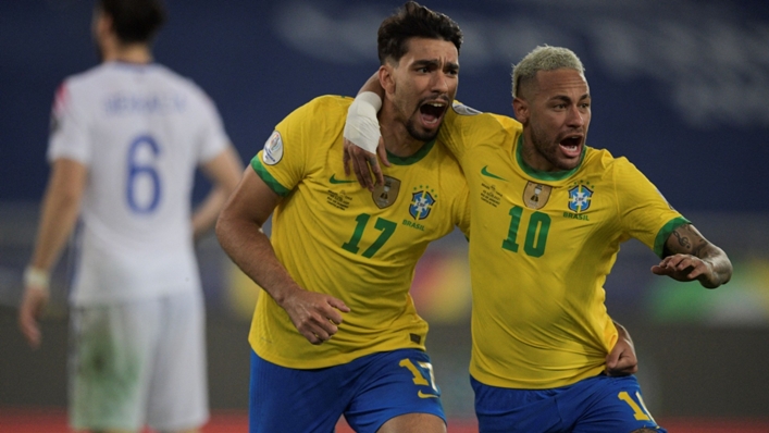 Lucas Paqueta (L) celebrates with Brazil team-mate Neymar (R)
