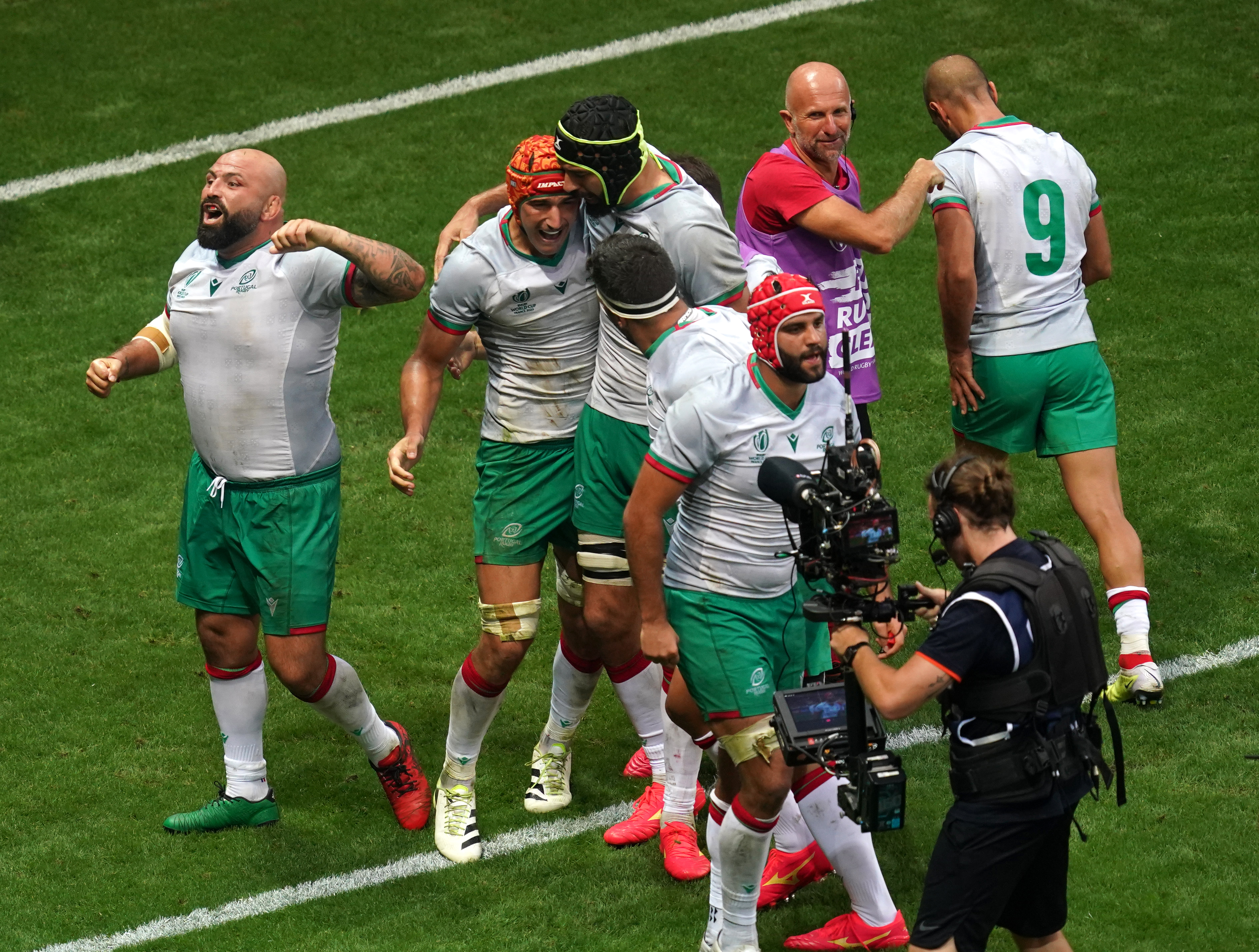 Nicolas Martins (second left) celebrates scoring Portugal's try