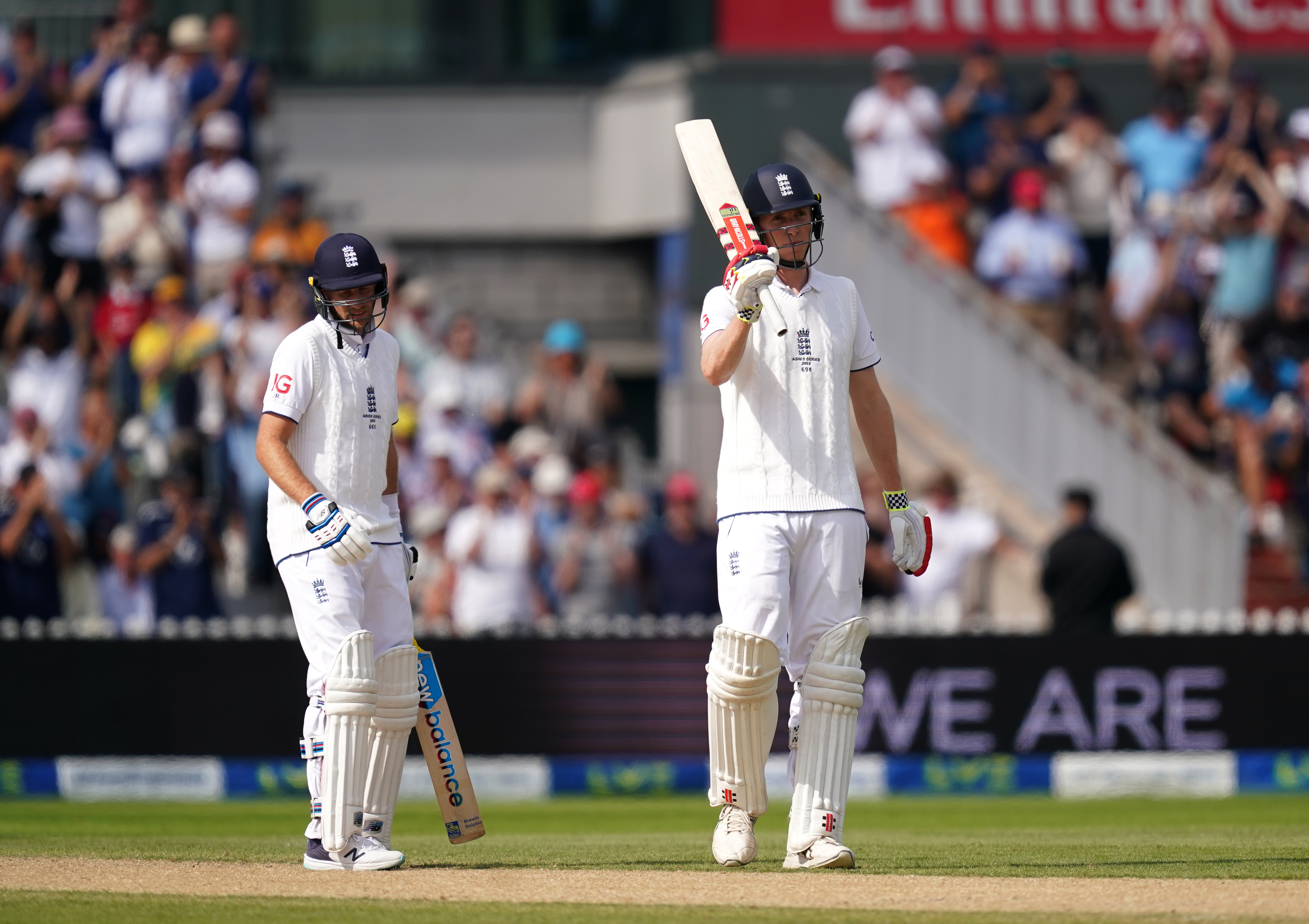 Zak Crawley, right, celebrates with Joe Root after reaching 150 at Old Trafford