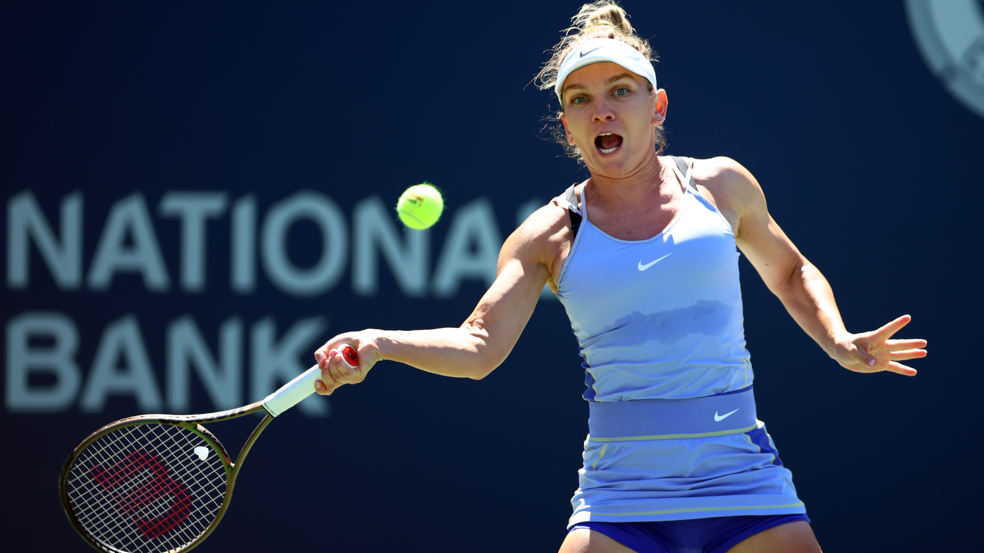 Simona Halep of Romania hits a shot against Coco Gauff of the United States during the Canadian Open