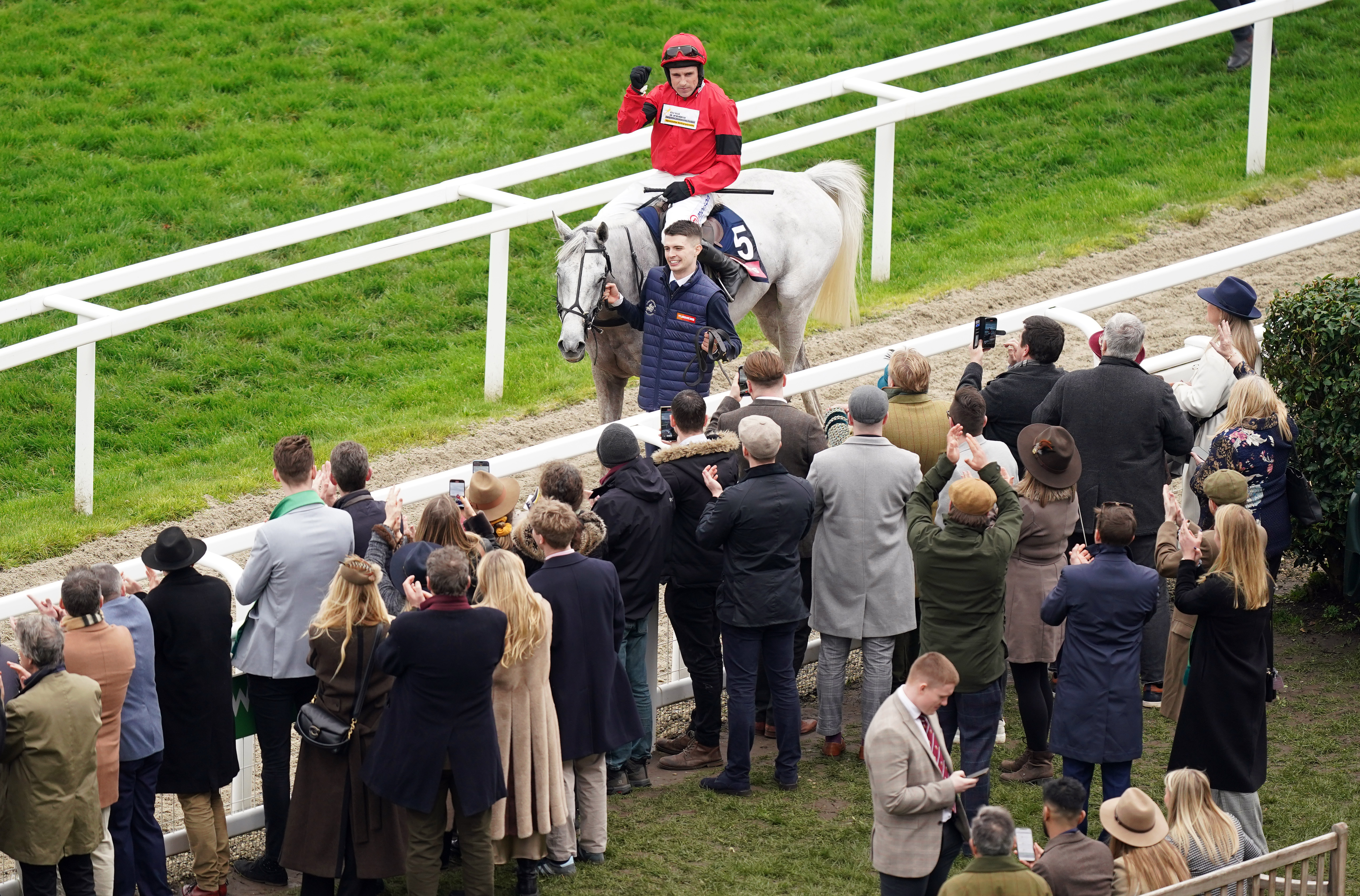 Harry Skelton aboard Grey Dawning after winning the Turners Novices’ Chase
