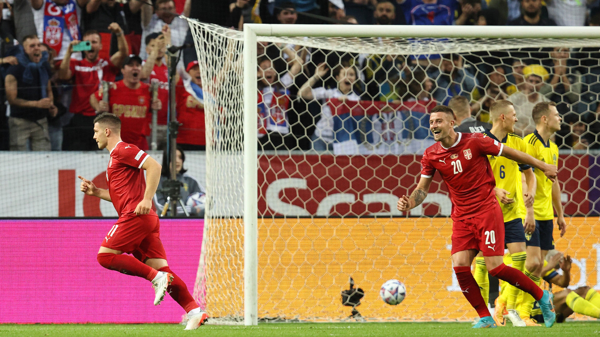 Luka Jovic (L) and Sergej Milinkovic-Savic (R) celebrate Serbia's goal against Sweden