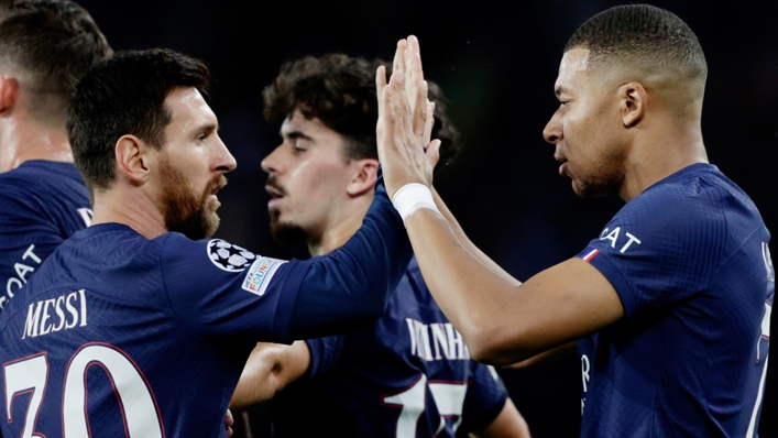 Lionel Messi celebrates with Kylian Mbappe