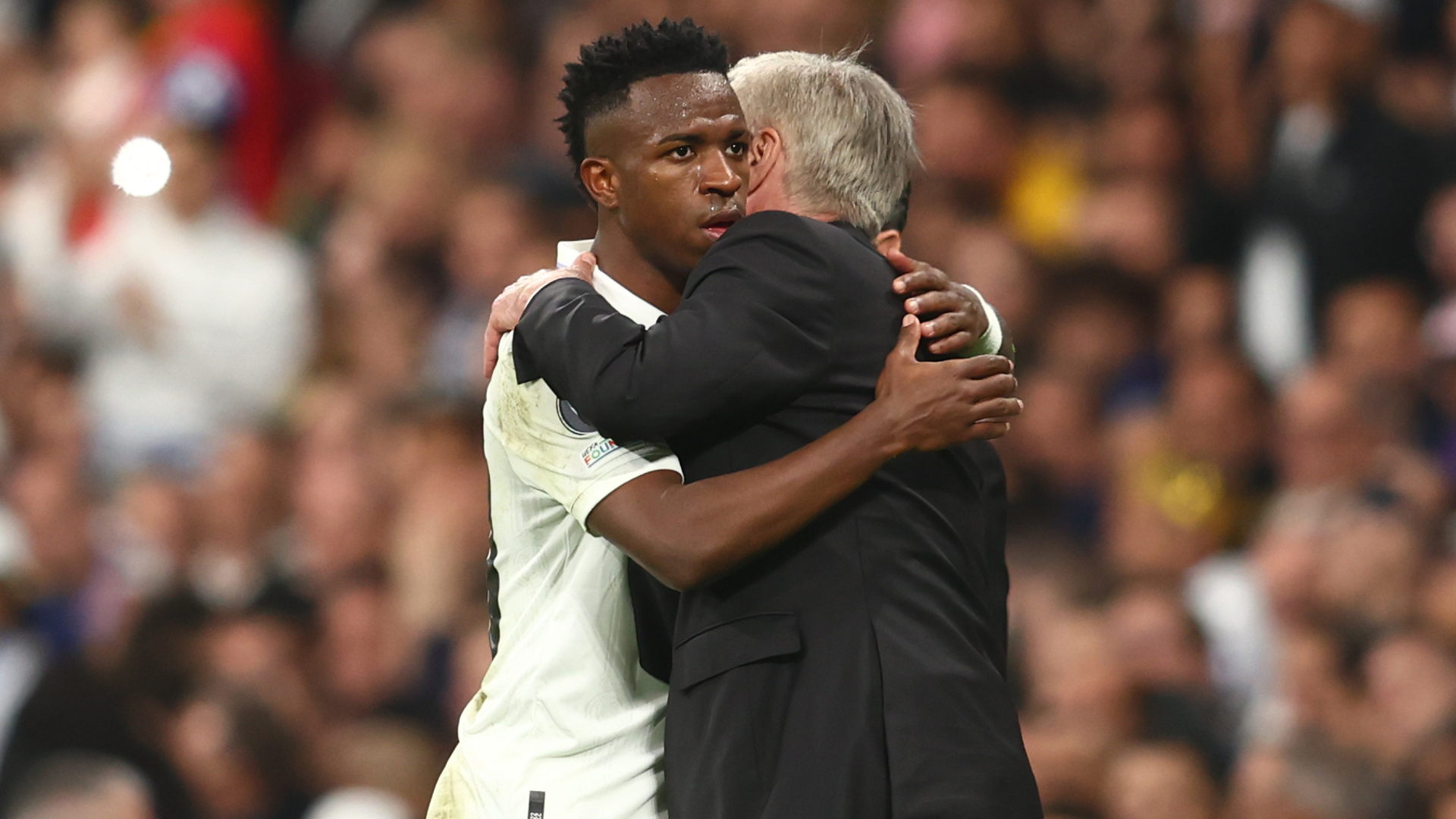 Vinicius Junior hugs Carlo Ancelotti
