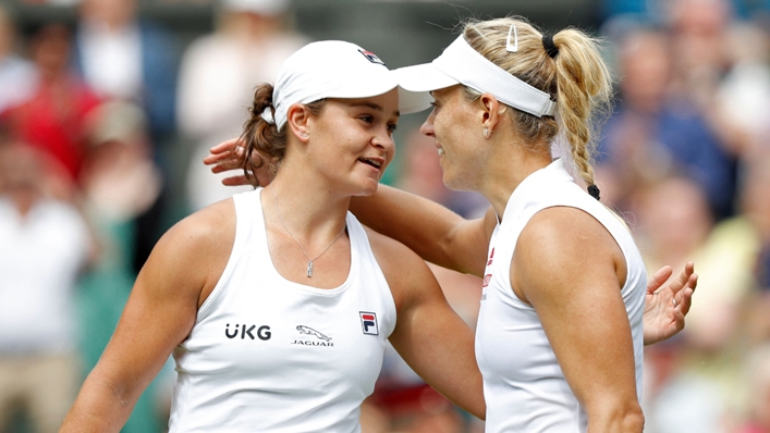 Ash Barty (left) meets Angelique Kerber at the net at the end of their semi-final