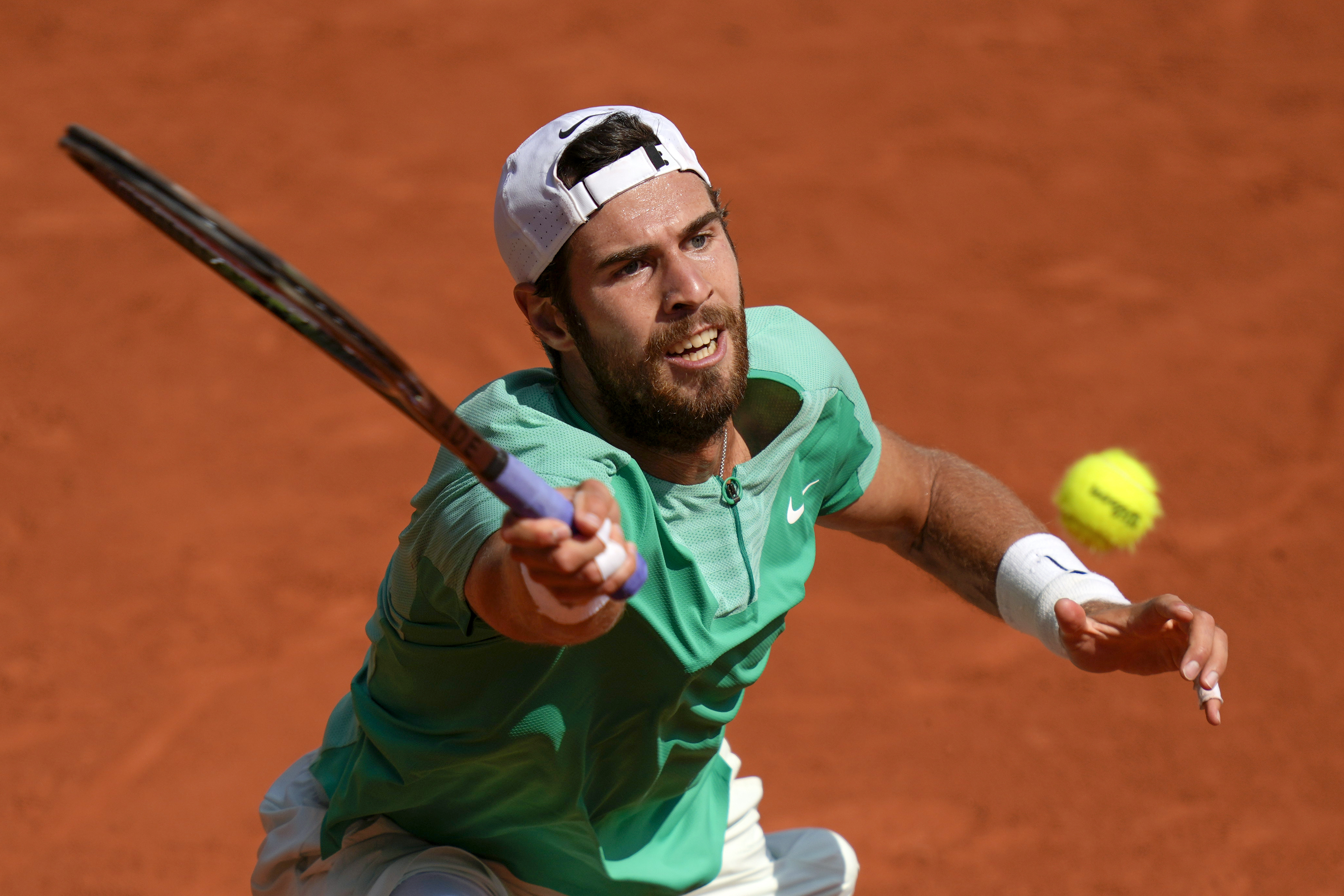 Karen Khachanov stretches for a forehand