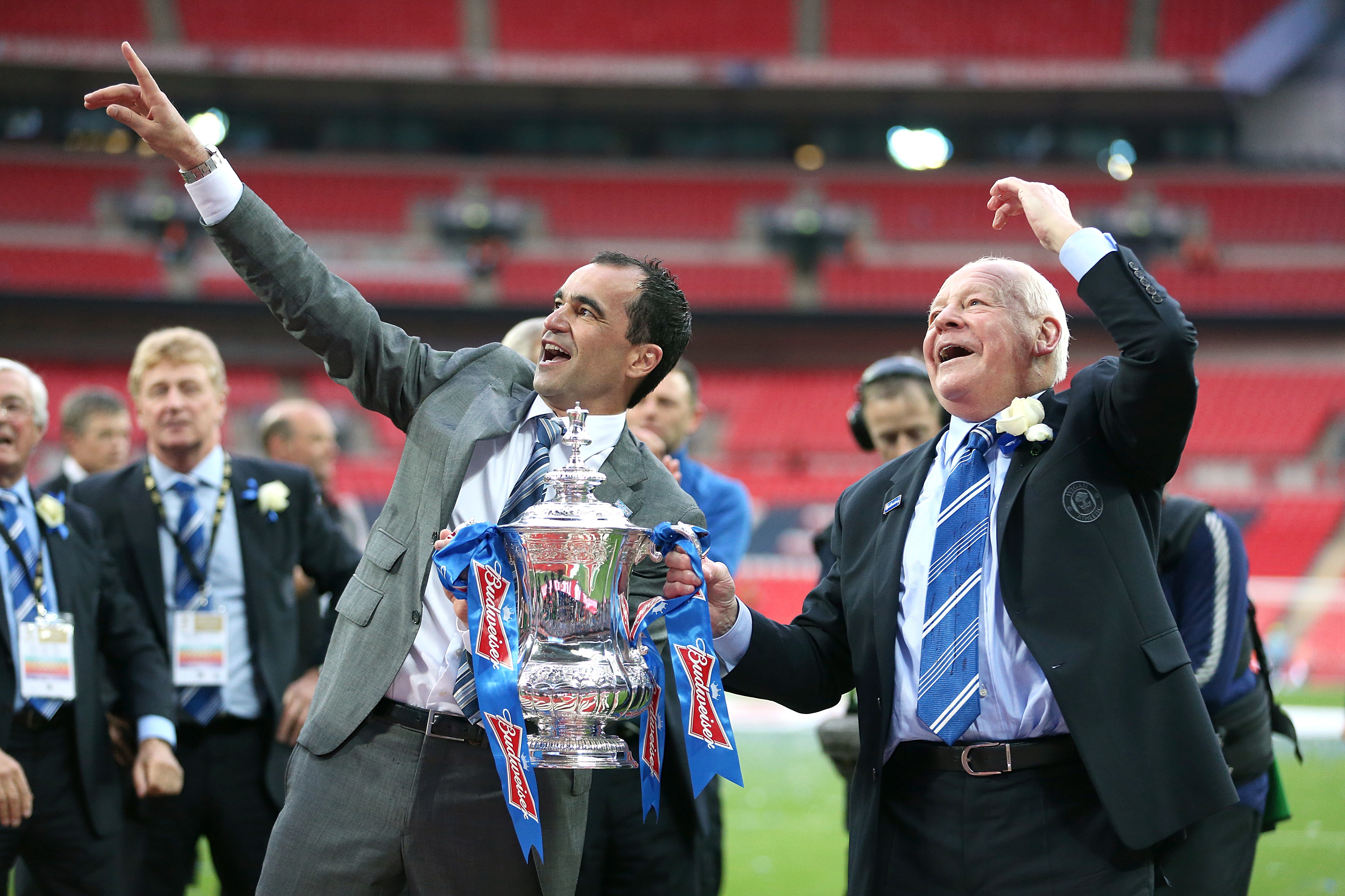 Wigan chairman Dave Whelan, right, savours the moment after his club's Wembley triumph