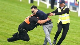 A protester is tackled by police and stewards at Epsom (Mike Egerton/PA)